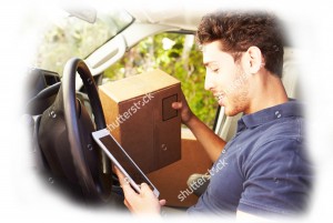 stock-photo-delivery-driver-sitting-in-2van-using-digital-tablet-221229850